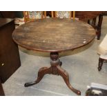 A 19th century tilt top tripod table