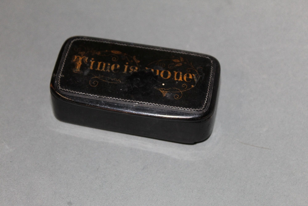 An early 19th century black papier-mache snuff box,