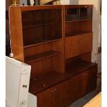 Two mid-20th century teak display cabinets with glass sliding doors,