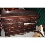 An Edwardian mahogany sideboard with raised serpentine back,
