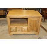 A modern oak TV stand with drawer and cupboard space to the base measuring 65 cm tall x 93 cm wide