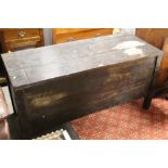 A large oak coffer raised on style feet measuring 73 cm tall x 150 cm long