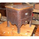 A 19th century oak commode,