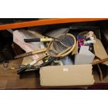 A box of vintage tennis rackets, spark guard,