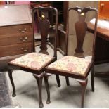 A pair of reproduction mahogany splat back dining chairs with patterned seats