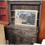 An oak carved dresser of 18th century style measuring 176 cm tall x 120 cm wide