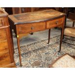 An Edwardian mahogany inlaid writing desk with tooled leather writing surface, two drawers,