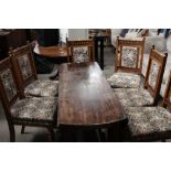 A group of 6 late 19th century oak dining chairs having floral upholstered backs and seats and