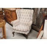 A 1920's /30's floral upholstered wing back arm chair