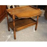 A 20th century oak 2 tier drop leaf table