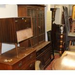 A late 19th century oak glazed bookcase with shaped pediment and astragal glazed doors measuring