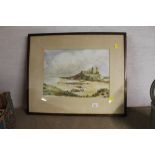 A framed and mounted watercolour of a castle and beach scene,