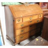 A 19th century oak bureau with fitted interior and 6 drawers measuring 104 cm tall x 106 wide