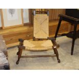 A pair of oak rush seat stools with dished tops