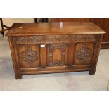 An oak carved coffer of small proportions,