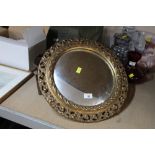 A circular convex mirror in gilt frame diameter 43 cm