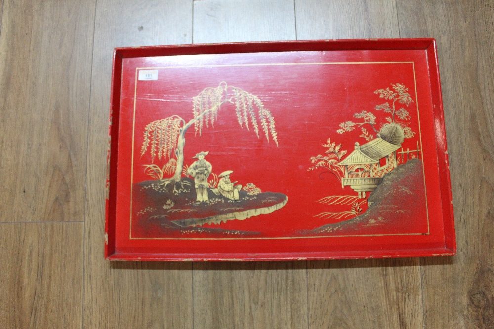 An oriental red lacquered rectangular tray
