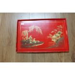 An oriental red lacquered rectangular tray