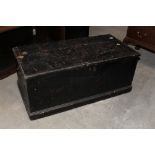 A late 19th century rectangular ebonised trunk with 2 carrying handles,