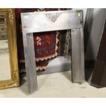 An Art Deco metal fire surround measuring 80 cm tall x 63 cm wide