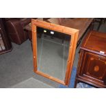 A modern pine framed rectangular mirror