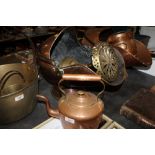 A copper coal scuttle together with copper kettle and and brassware