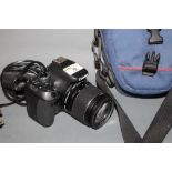 A Canon EOS 600 digital SLR camera with 18-55 mm lens and a Lowe Pro camera bag together with a