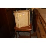 A miniature pine hanging corner cabinet and and a rectangular mahogany occasional table