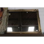 A gilt framed rectangular mirror