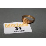 A Victorian 9ct gold horse shoe pattern signet ring, Chester 1882,