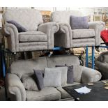 A 3 piece silver coloured and floral decorated suite, comprising a 2 seater settee and 2 armchairs,