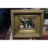 A gilt framed print of a dog within interior setting