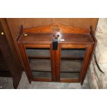 A late 19th century mahogany glazed bookcase measuring 75 cm tall and 72 cm wide