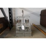 2 cut glass decanters with decanter labels and displayed in a plated stand