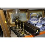 A group lot of brassware, to include candle sticks, oil lamp,