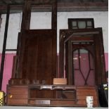 A quantity of timber and veneers to include mahogany book case and cupboard doors,