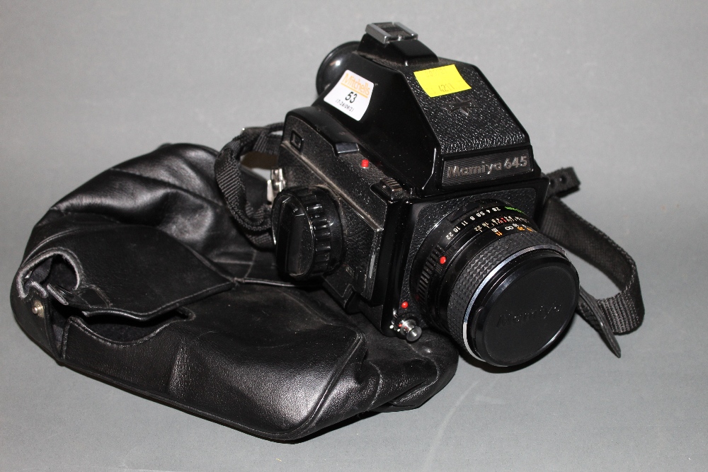 A Mamiya 645 large format camera, G 125849, with Mamiye-Sekor 80 mm lens,
