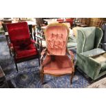 A Victorian style spoon back armchair upholstered in deep buttoned material