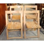 A group of 4 folding slatted chairs