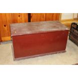 A late 19th century red painted chest measuring 55 cm tall 109 cm long