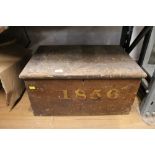 A Victorian pine trunk inscribed "1856" and containing wood planing tools