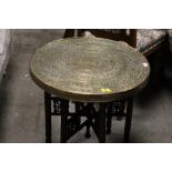 An eastern brass tray topped table