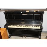 A Bechstein ebonised upright piano