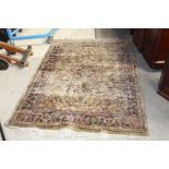 An eastern fringed and patterned rug woven in blue and green and measuring 120 cm wide x 180 cm