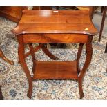 An Edwardian figured mahogany 2 tier occasional table