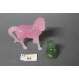 A rose quartz carving of a standing horse together with a jade cat