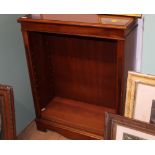 A modern yew wood bookcase with adjustable shelves,