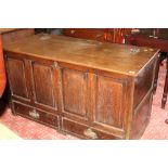 A 19th century oak paneled mule chest measuring 70 cm tall x 128 cm long