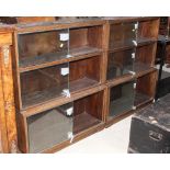 A pair of 1950's oak sectional book cases,