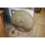 A large stone grinding wheel